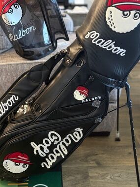 Malbon Black golf bag W/Magnetic pocket. And 2 covers.